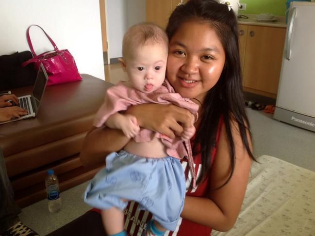 SRIRACHA , THAILAND - AUGUST 6: In this handout photo Thai surrogate mother Pattaramon Chanbua poses with baby Gammy at the Samitivej Hospital on August 6, 2014 in Chonburi province in Bangkok, Thailand. David and Wendy Farnell have made international headlines for abandoning their disabled infant son, Gammy, in Thailand with his surrogate mother, Pattaramon Chanbua. Gammy's twin sister lives with the Farnells at their home in Bunbury, Western Australia. The couple have denied abandoning their son on a recent television interview in Australia. (Handout photo via Getty Images)