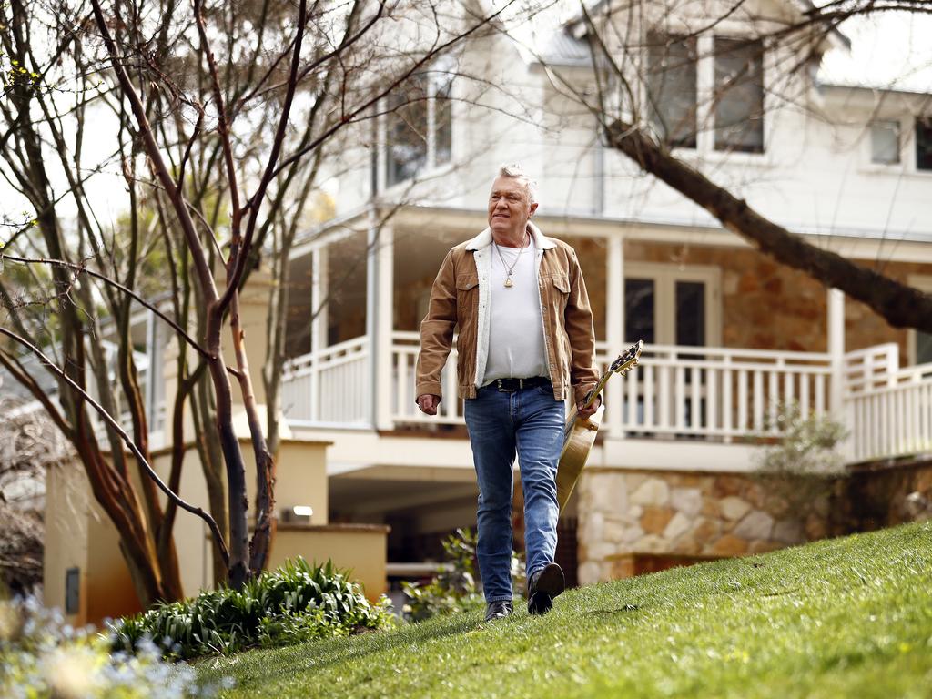 Walks in the garden ... Jimmy Barnes often thinks back to happy days at home with the dogs. Picture: Sam Ruttyn