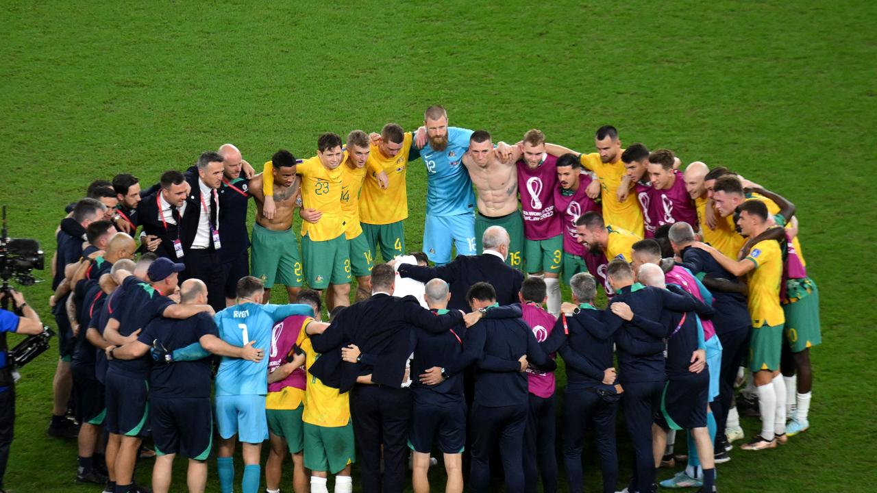 Australia's players celebrate the special moment. Photo by NICOLAS TUCAT / AFP.