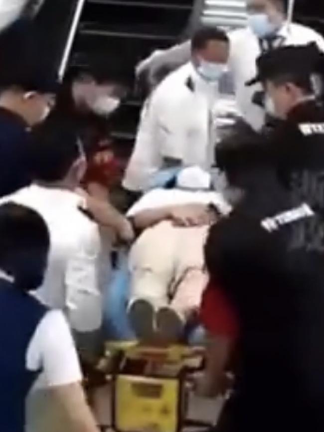 She has to be taken away on a stretcher. Picture: Twitter