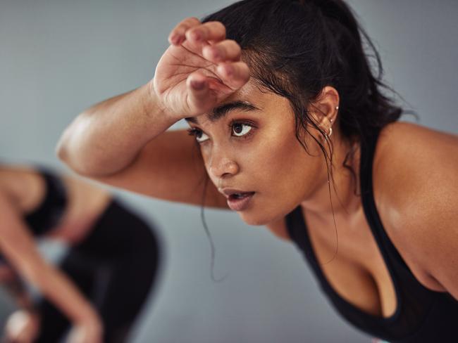 Shot of a young woman taking a break from her workout at the gym