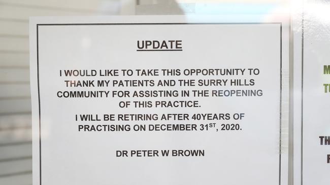 A sign on the window at the Surry Hills practice of Dr Peter Brown. Picture: Richard Dobson