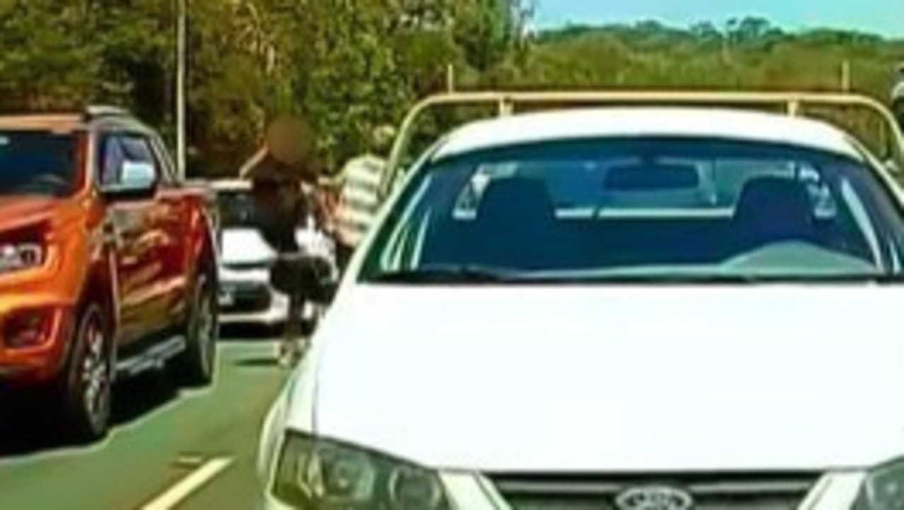 A driver kicks the other motorist. Picture: Dash Cam Owners Australia/Facebook