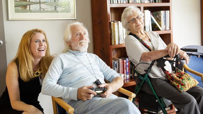 Alex McCord with Feros Village residents Hugh Webster and Lois Sanderson