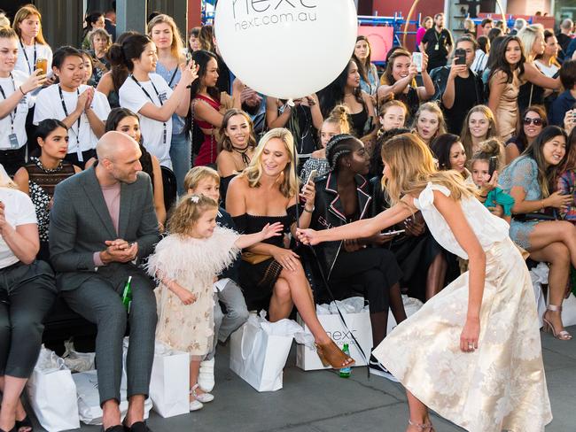 Rebecca gives daughter Billie a balloon at the show's conclusion.