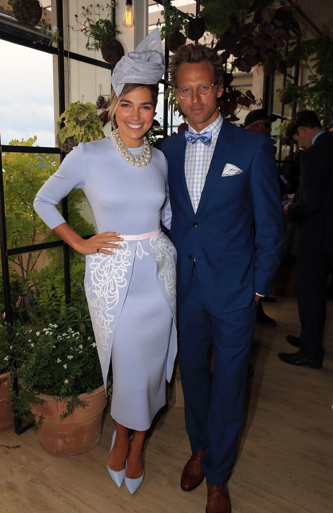 Ashley Hart and Buck Palmer in the Birdcage at the 2014 Melbourne Cup. Picture: Alex Coppel.