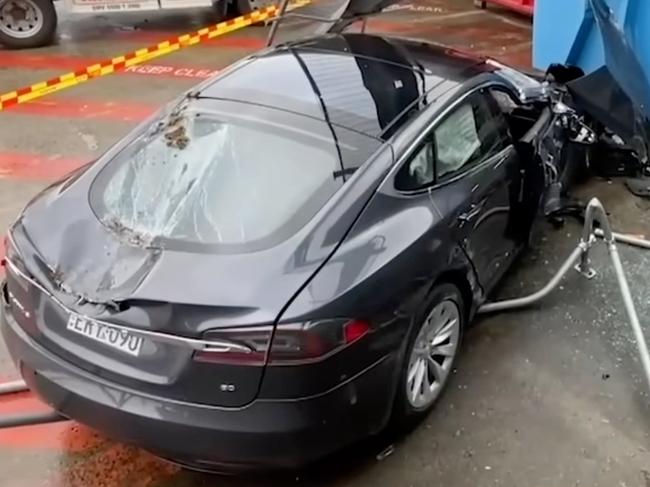 Two people were hospitalised following a dramatic crash involving a Tesla Model S in Sydney. Picture: Nine Network