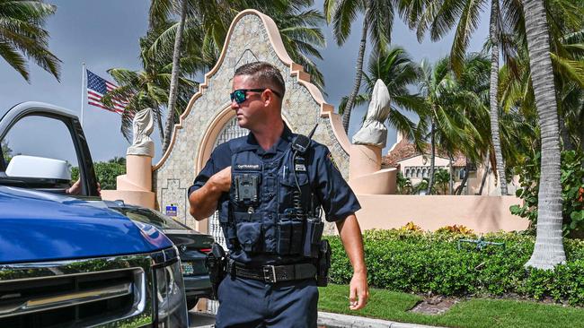 Local law enforcement remain outside Mar-a-Lago in Palm Beach, Florida. Picture: AFP