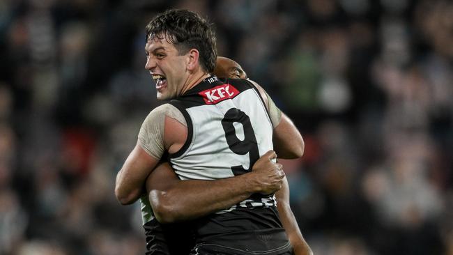 ADELAIDE, AUSTRALIA - SEPTEMBER 13: Esava Ratugolea   and  Zak Butters of the Power celebrate the final siren   during the AFL Second Semi Final match between Port Adelaide Power and Hawthorn Hawks at Adelaide Oval, on September 13, 2024, in Adelaide, Australia. (Photo by Mark Brake/Getty Images)