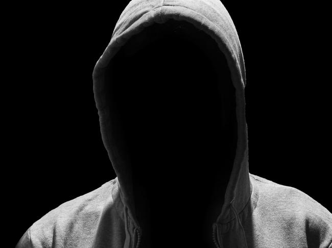 Portrait of Invisible man in the hood isolated on black background creep pervert molestor generic Photo: iStock