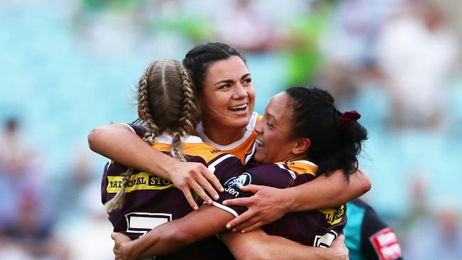 Millie Boyle celebrates with Ali Brigginshaw (left) and Amy Turner (right) after winning the 2019 NRLW grand final match. Picture: Matt King/Getty Images