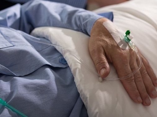 Close-up of terminally ill man's hand with dripEuthanasiaElderlyOldSickRendezView