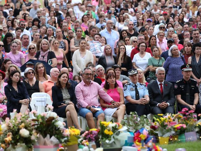 Lloyd and Suzanne Clarke, (centre at front) parents to Hannah Clarke, attend a vigil to remember the murdered mother and her three children. (Photo by Jono Searle/Getty Images)