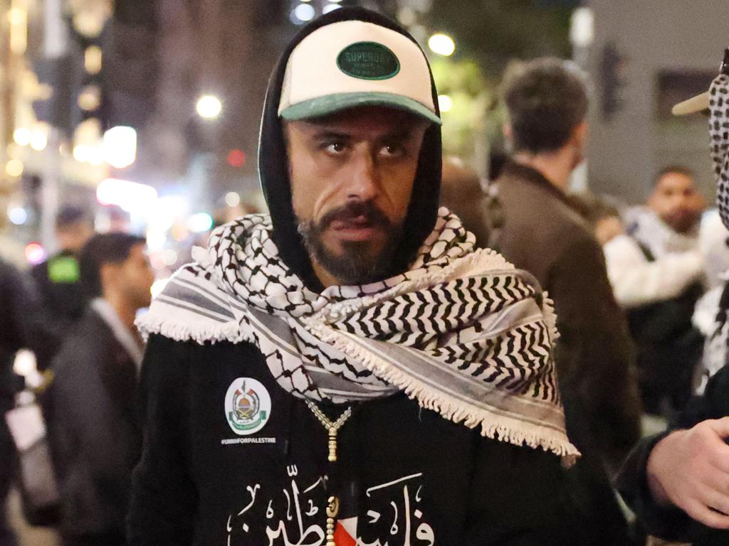 Mr Sharab seen wearing the Hamas emblem at a rally at Federation Square. Picture: Brendan Beckett