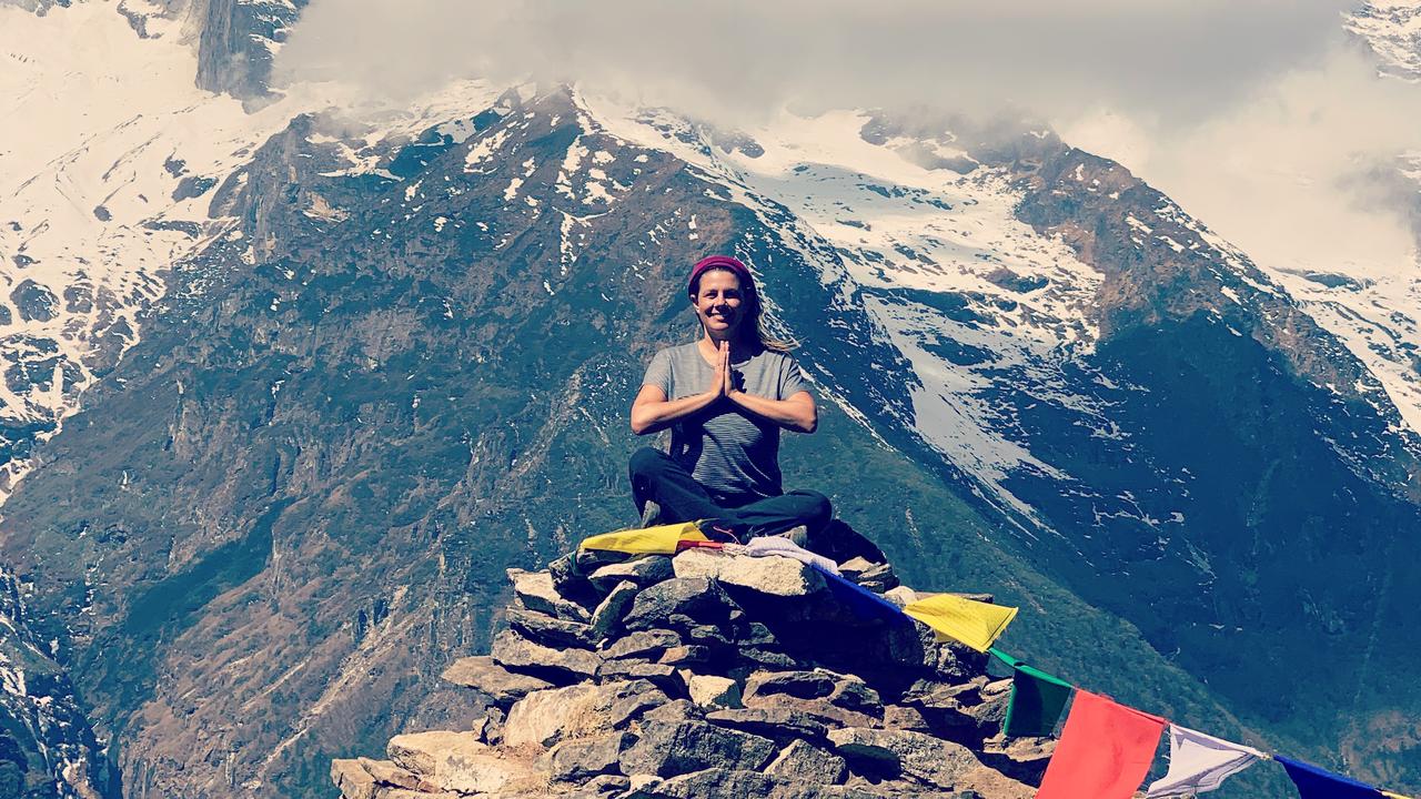 Bright prayer flags add some colour to the barren, rocky landscape.