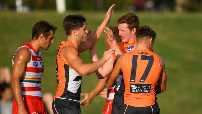 Tom Green (right) celebrates after kicking a goal. Picture: AAP Image