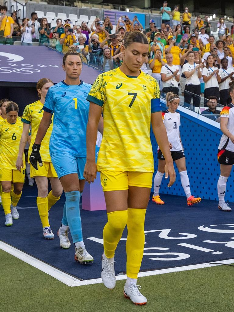 Steph Catley leads the Matildas out for the game against Germany.