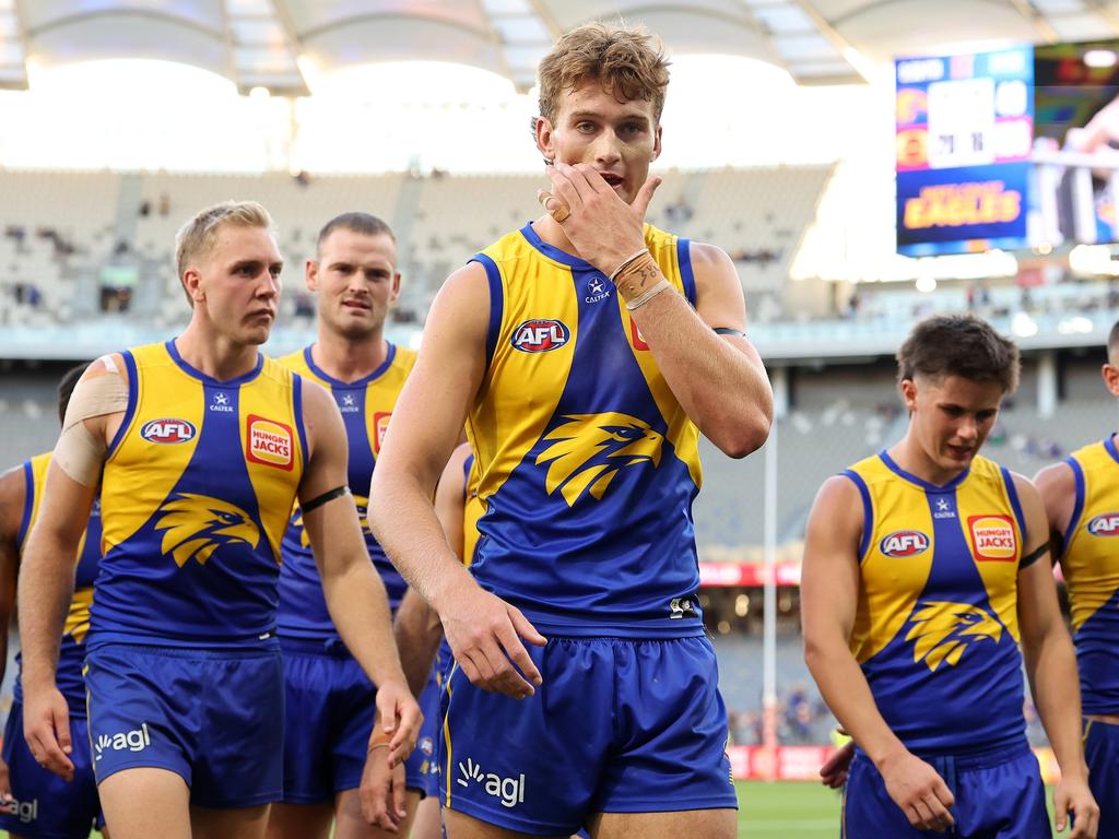 A dejected Archer Reid (centre) and his West Coast Eagles teammates reflect on last Sunday’s 87-point loss to the Gold Coast Suns. Picture: Paul Kane/Getty Images