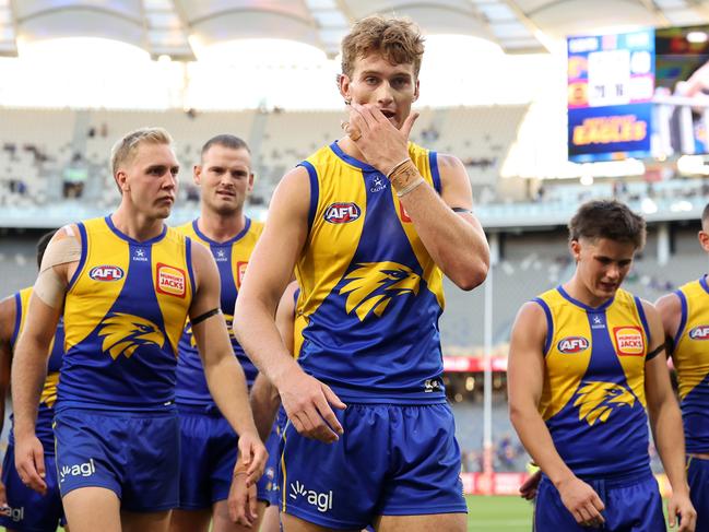 A dejected Archer Reid (centre) and his West Coast Eagles teammates reflect on last Sunday’s 87-point loss to the Gold Coast Suns. Picture: Paul Kane/Getty Images