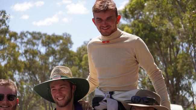 Cameron McDougall on the shoulders of teammates after his success in the Skid Pad event. Photo: Contributed