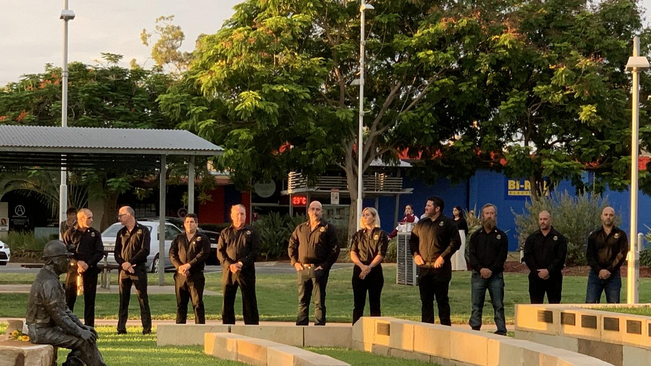 (From left to right) Moranbah Miners’ Memorial Committee members Andy Collins, Rob Grieve, Brody Brunker, Simon West, Scott Leggett, Kelly Vea Vea, Luke Reynolds, Pat Meldrum, Rory Bean and Daniel Vincent stand by the memorial in the twilight just before 6pm on March 26. Picture: Duncan Evans