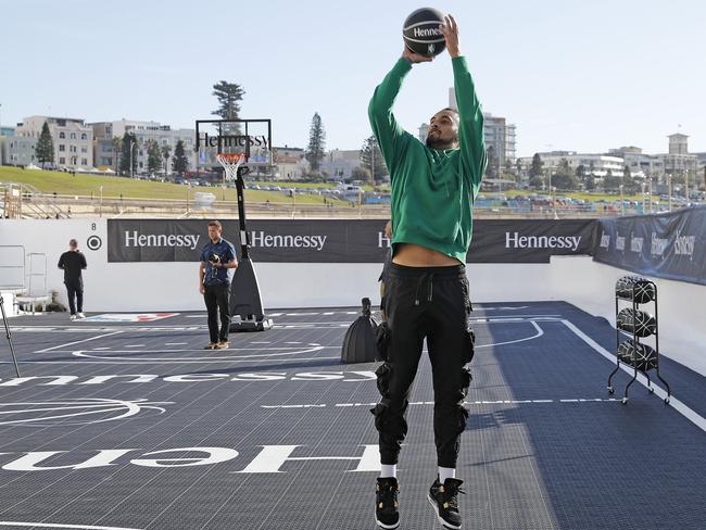 Tennis star Nick Kyrgios takes part in the Hennessy basketball event in an empty Bondi Icebergs ocean pool. Picture: Toby Zerna