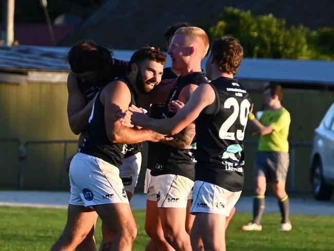 Brodie Palfreyman is congratulated by teammates during his 11-goal haul for Launceston against Scottsdale. Picture: Launceston FC