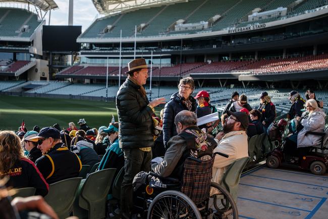 Film crew are seen talking to actors in front of Crows and Port Adelaide fans at Adelaide Oval. Picture: Morgan Sette/The Advertiser