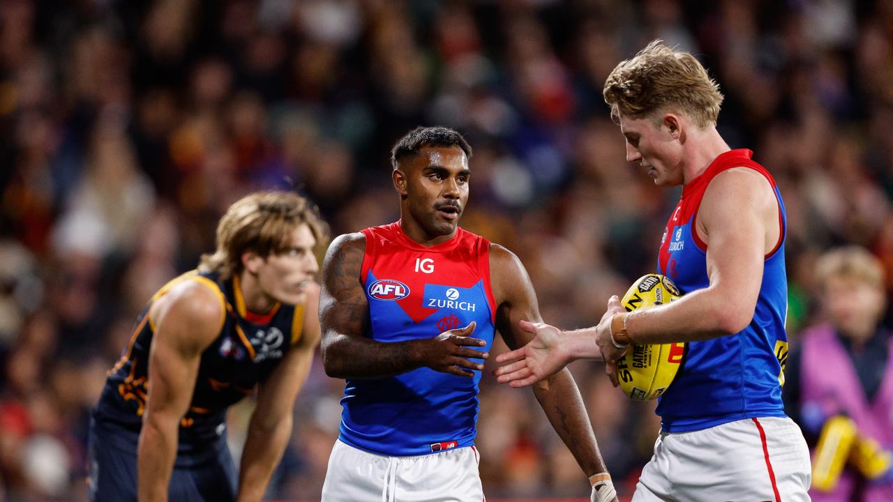 ADELAIDE, AUSTRALIA - APRIL 04: Kysaiah Pickett is seen with Jacob van Rooyen of the Demons during the 2024 AFL Round 04 match between the Adelaide Crows and the Melbourne Demons at Adelaide Oval on April 04, 2024 in Adelaide, Australia. (Photo by Dylan Burns/AFL Photos via Getty Images)