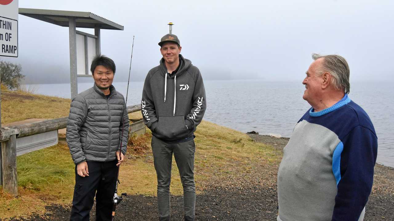 ON THE LINE: Renowned Japanese chef Zaiyu Hasegawa, whose restaurant is rated 12th best in the world and best in Japan, took time out from his starring role in The Curated Plate foodie event on the Sunshine Coast, to wet a line at Borumba Dam. Also well known as a bass fishing enthusiast, his hosts were champion bass angler Braden Schuch and Lake Borumba Fish Stocking Association worker Don MacAulay. Picture: Arthur Gorrie