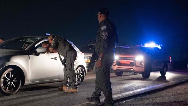 Israeli police secure the site of a drone strike near the northern Israeli town of Binyamina. Picture: AFP.