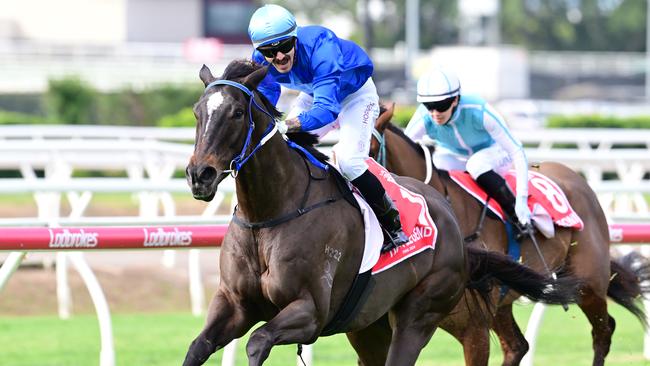 Tiger Legend wins the Battle Of The Bush final at Eagle Farm for jockey Ash Butler and trainer John Manzelmann. Picture: Grant Peters - Trackside Photography.