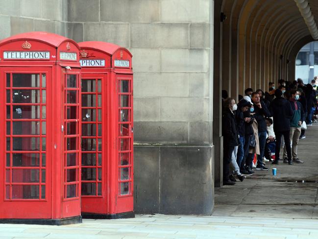 Members of the public in Manchester wait for a dose of a Covid-19 vaccine, as cases in the UK soar to record levels. picture: AFP