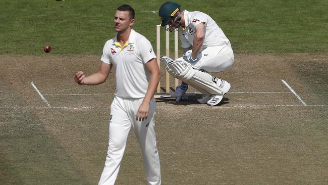 Josh Hazlewood makes life uncomfortable for Cameron Bancroft.