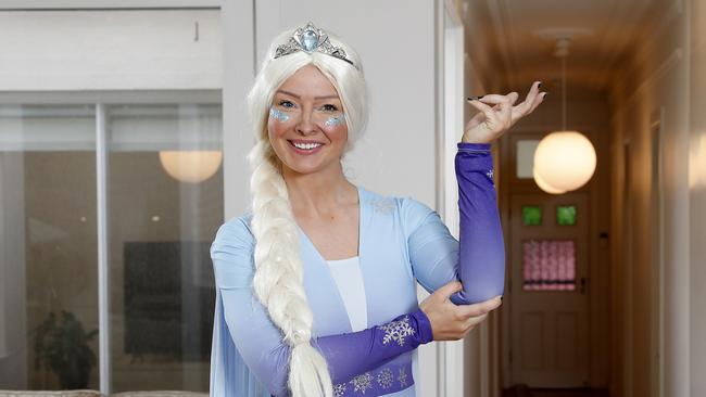 SMARTDaily - Kath Solly works in the advertising industry and has a side gig as a children's entertainer called Supa Dupa Kids Parties to earn extra cash. Pictured at home in Bronte in her 'Elsa' outfit. Picture: Toby Zerna