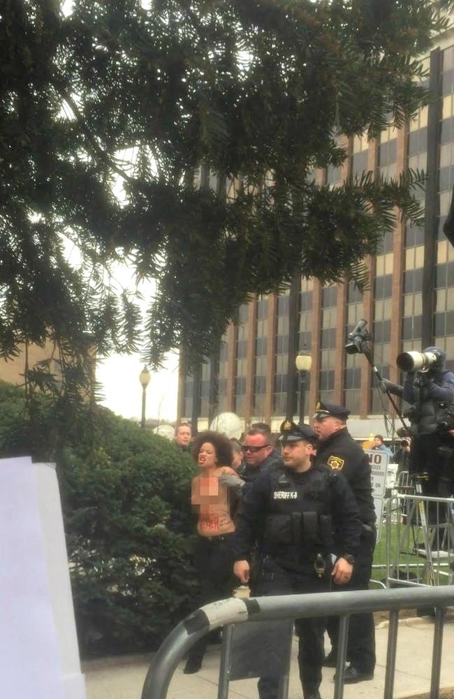 The topless protester screamed, ‘Women’s Lives Matter!’ as she was taken into custody.