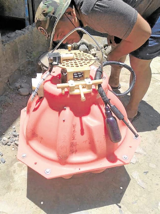 Fishermen recovered this object with Chinese markings that later turned out be an ocean bottom seismometer. Picture: People’s Development Institute.