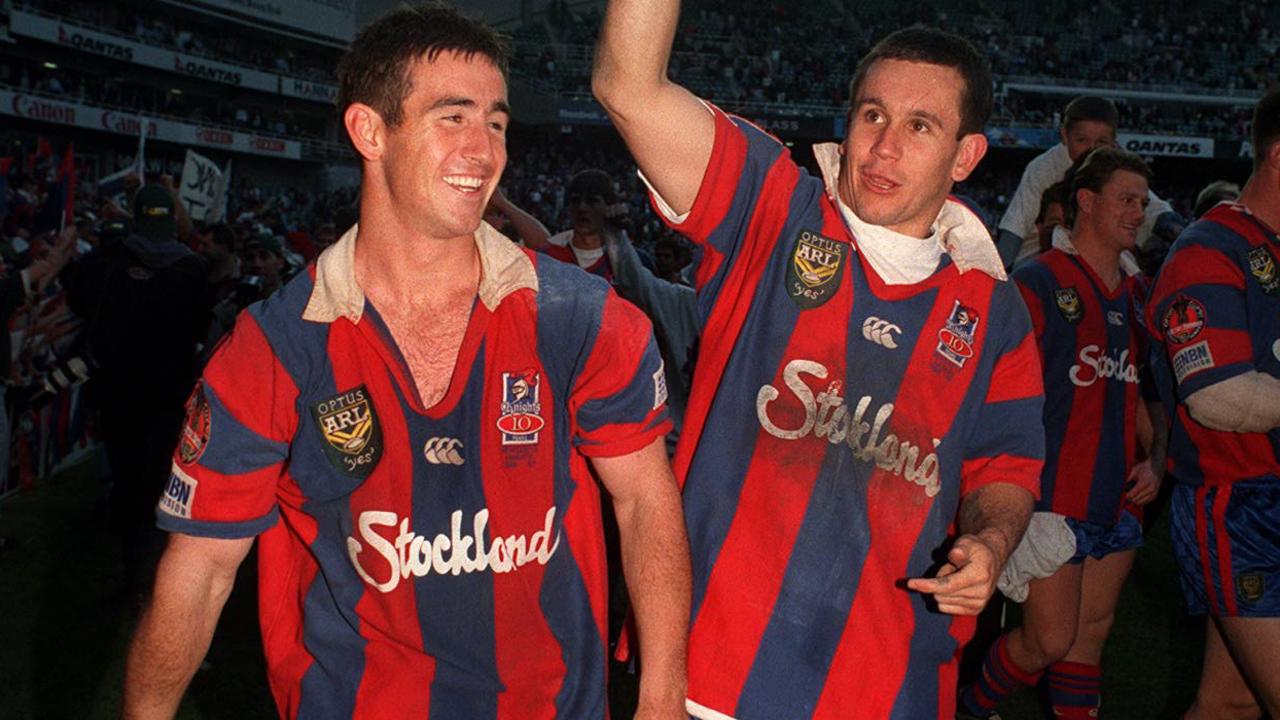 Andrew Johns and Matty Johns do a lap of honour after Newcastle’s 1997 grand final triumph.