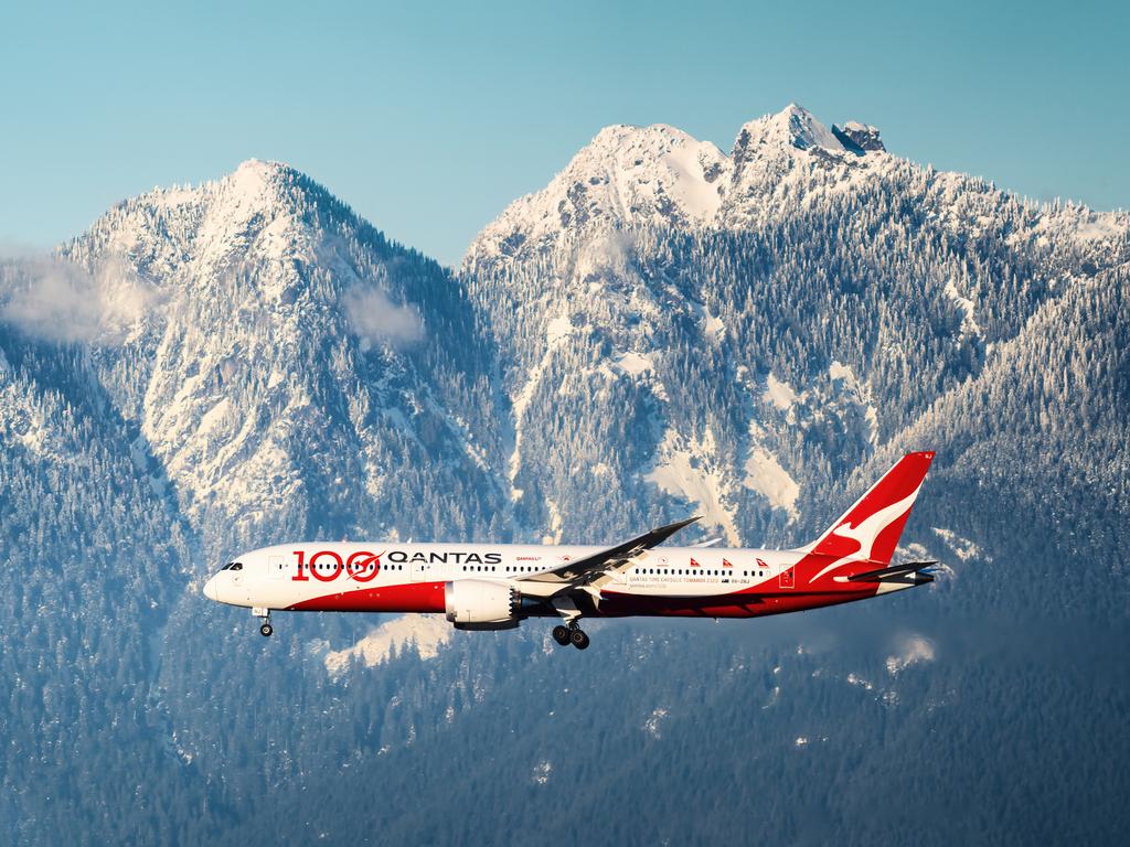Qantas Boeing 787 "100th Anniversary" livery flying in front of mountains on final for Vancouver International Airport Date: Dec 20, 2021