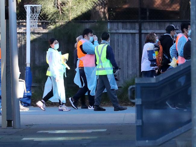 Cleaning crews arriving at Lane Cove West Public school today where a Year 2 student contracted COVID-19 causing it to shut down.