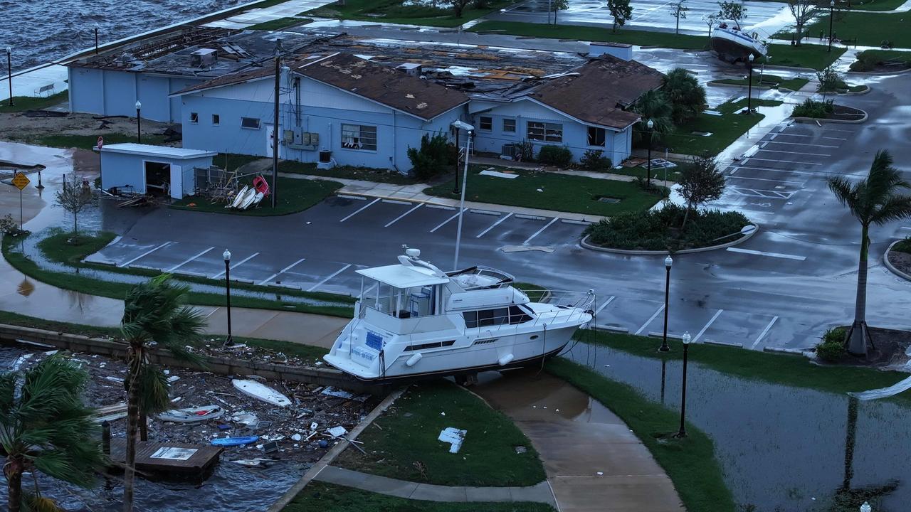 PUNTA GORDA - OCTOBER 10: In this aerial view, a boat is washed ashore from when Hurricane Milton passed through the area on October 10, 2024, in Punta Gorda, Florida. The storm made landfall as a Category 3 hurricane in the Siesta Key area of Florida, causing damage and flooding throughout Central Florida.   Joe Raedle/Getty Images/AFP (Photo by JOE RAEDLE / GETTY IMAGES NORTH AMERICA / Getty Images via AFP)