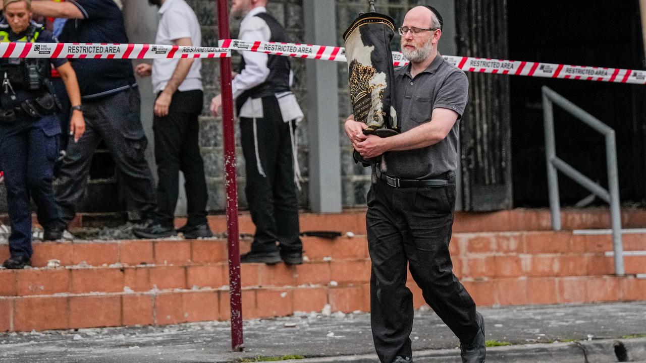 A member of the Jewish community recovers an item from the Adass Israel Synagogue Picture: Asanka Ratnayake/Getty Image