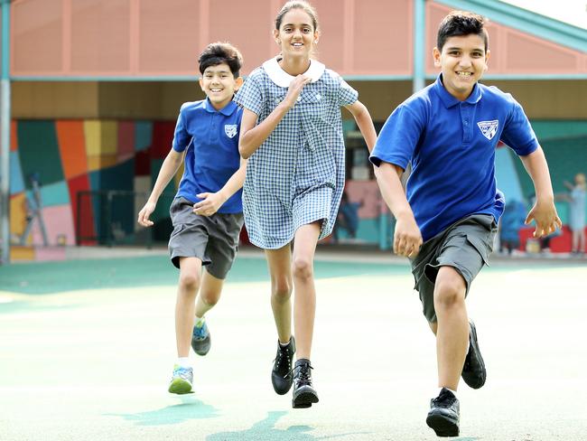 Amir Mohammadi, 12, Millen Batth, 11 and Raeed Nawaseri, 10, at Merrylands East Public School. Picture: Tim Hunter.