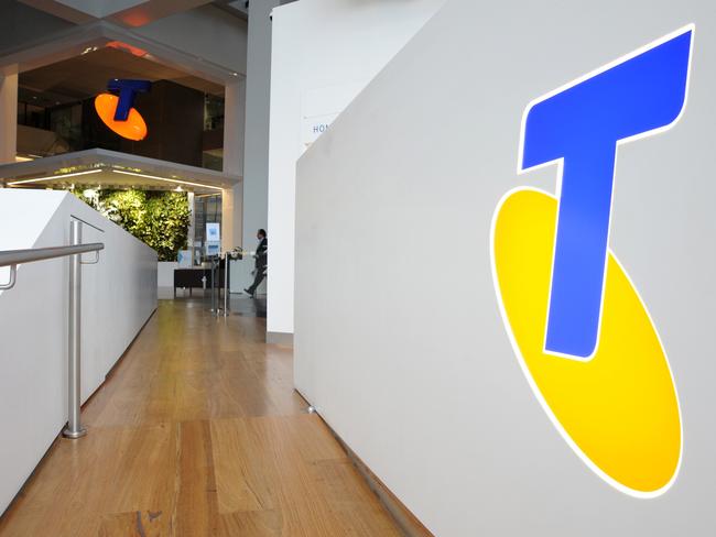 A Telstra Corp. logo is displayed at the entrance to one of the company's retail stores in Melbourne, Australia, on Thursday, Aug. 11, 2011. Telstra Corp. reported A$3.23 billion in full-year profit as second-half earnings beat analysts' estimates after winning mobile customers, and operating costs and executive jobs were cut. Photographer: Carla Gottgens/Bloomberg via Getty Images