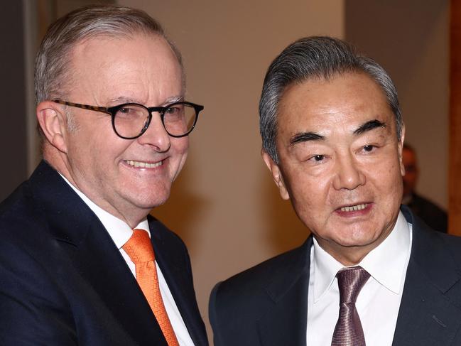 Australian Prime Minister Anthony Albanese (L) receives Chinese Foreign Minister Wang Yi for a meeting in Canberra on March 20, 2024. Wang began a whirlwind visit to Australia on his rare trip marking a thaw in relations between the two trading partners. (Photo by David GRAY / AFP)