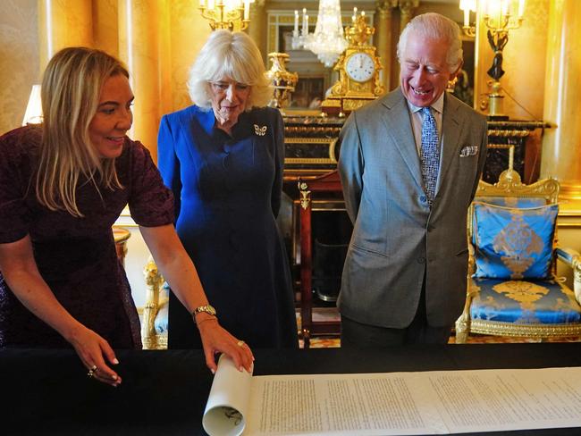 King Charles III and Queen Camilla are presented with the Coronation Roll, an official record of their Coronation, by the Clerk of the Crown in Chancery, at Buckingham Palace. Picture: AFP