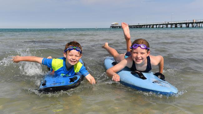 Jayden and Serina hit the water at Semaphore Picture: AAP / Keryn Stevens