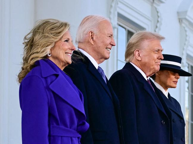 TOPSHOT - (L-R) US President Joe Biden and First Lady Jill Biden greet President-elect Donald Trump and Melania Trump as they arrive at the White House in Washington, DC, on January 20, 2025, before departing for the US Capitol where Trump will be sworn in as the 47th US President. (Photo by Jim WATSON / AFP)