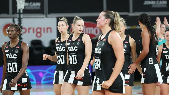 Collingwood players look dejected after a narrow loss to the Melbourne Vixens that was shrouded in controversy.