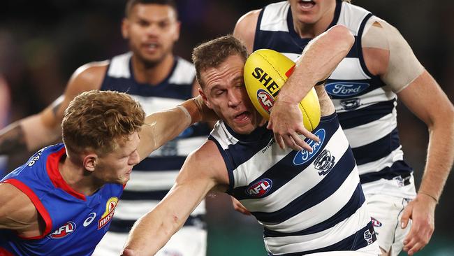 Joel Selwood and Bulldog Adam Treloar do battle in the middle. Picture: Michael Klein